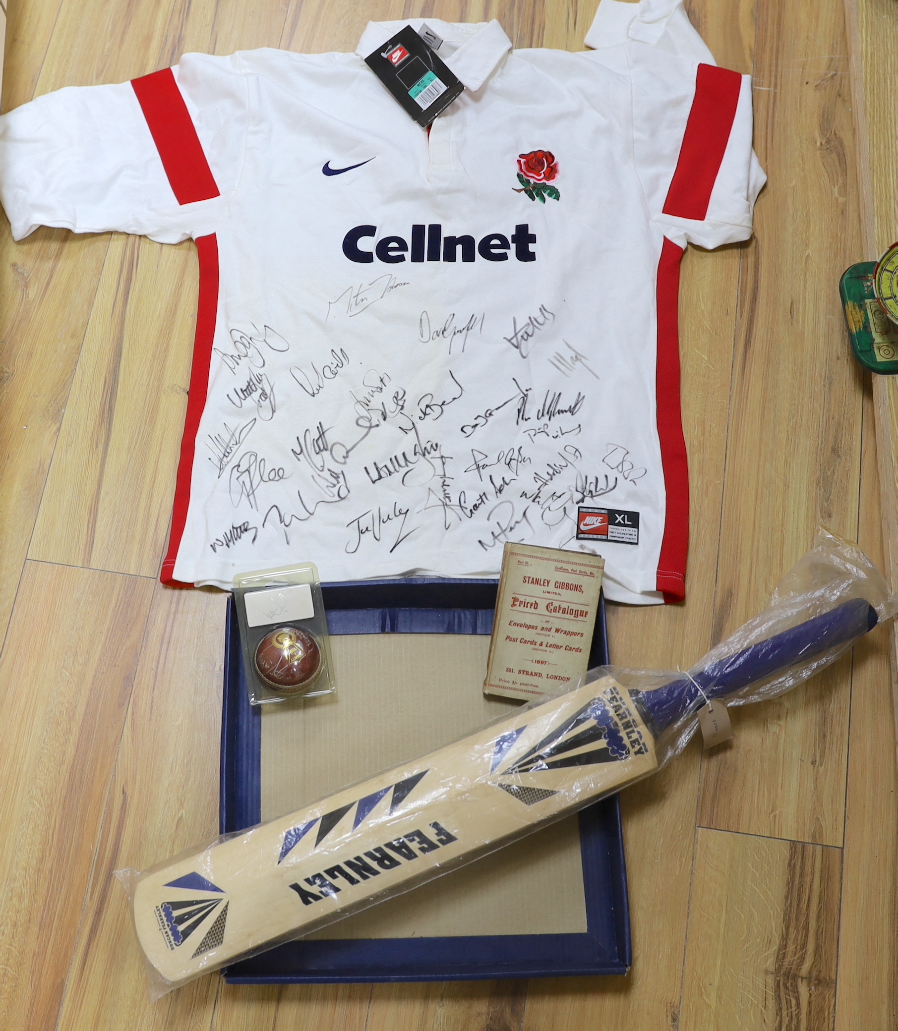 An autographed England rugby shirt, a similar England -v- South Africa 1998 Test Series cricket bat and a cricket ball